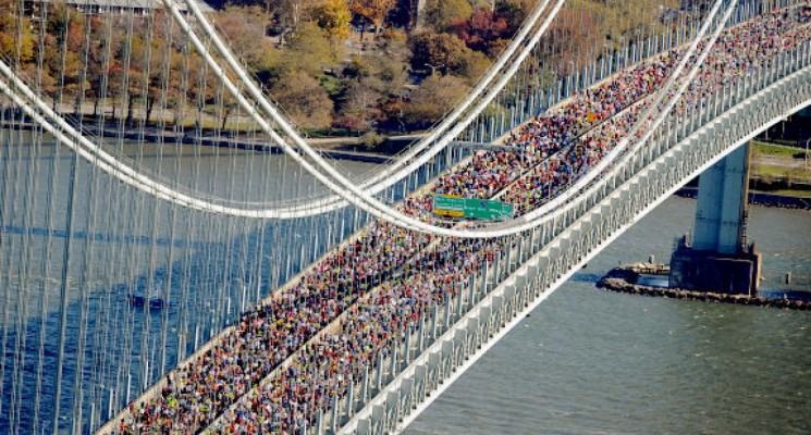 Runners crossing bridge